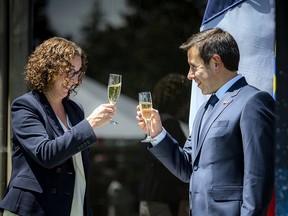 Marta Morgan, deputy minister of Global Affairs Canada, and Frank Marchetti, chargé d’affaires for the Embassy of France, cheered one another at the Bastille Day reception hosted by the French embassy Thursday, July 14.