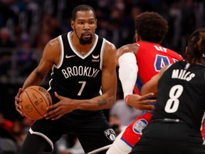 Brooklyn Nets forward Kevin Durant (7) gets defended by Detroit Pistons forward Saddiq Bey (41) during the third quarter at Little Caesars Arena on Nov. 5, 2021.