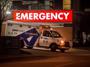 An ambulance leaves the Emergency area of Toronto Western Hospital during the COVID-19 pandemic, Thursday January 6, 2022. It's part of the University Health Network (UHN), which manages three of the GTA's largest hospitals with more than 1,200 beds and nearly 18,000 staff.