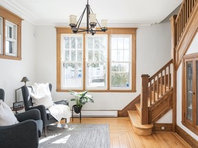 "We staged this craftsman style home with a large front sitting room. I decided to put two chairs with an area rug to make it more cozy. Using the reading lamp the owners left gave that rustic feel." – Joanne Vroom PHOTO: LINA CERAVOLO