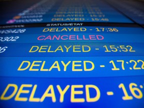 Delayed flights on a sign board.
