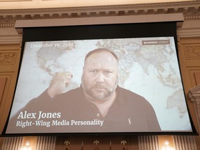 FILE PHOTO: Right-Wing Media Personality Alex Jones appears on the screen during a public hearing of the U.S. House Select Committee to investigate the January 6 Attack on the U.S. Capitol, on Capitol Hill in Washington, U.S., July 12, 2022.
