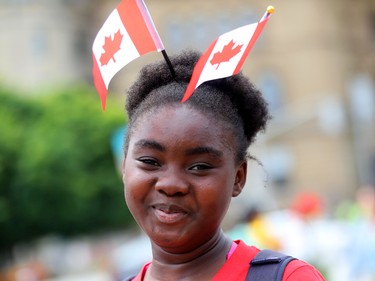 Marcela Kouotou of Gatineau enjoys the Canada Day festivities in Ottawa on Friday.