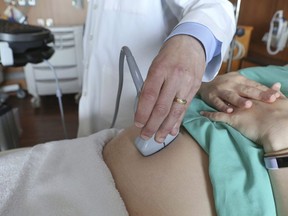 A doctor performs an ultrasound scan on a pregnant woman at a hospital in Chicago,&ampnbsp;Aug. 7, 2018.