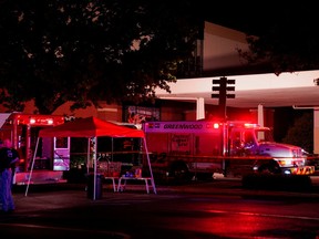 Law enforcement officers stand guard near the crime scene after a shooting at a mall in the Indianapolis suburb of Greenwood, Indiana, U.S. July 17, 2022.