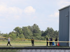 Investigators at the scene of the Arnprior airport skydiving tragedy on Wednesday.
