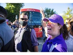 Chelsea Hillier, pictured here protesting an appearance by Prime Minister Justin Trudeau in the London area during the 2021 federal election campaign, has been ordered to pay nearly $100,000 for defaming a Carleton University instructor.