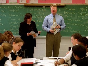 Sue Sherring and Trevor White present the Economics of Staying in School to St. Joseph's students.