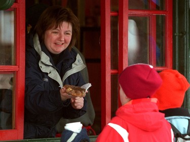 The Ottawa Suns' Sue Sherring works at a Beaver Tail hut on the Rideau Canal February 12, 2002.