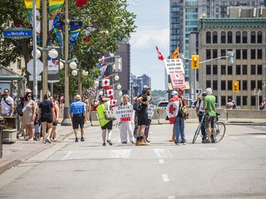 A very small group of "freedom" protesters were on Wellington Street outside the gates of Parliament Hill on Saturday afternoon.