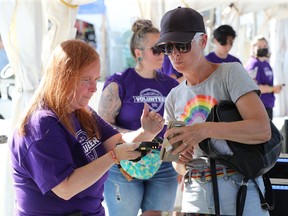 Concertgoers get their passes scanned on the first night of the Ottawa Bluesfest.