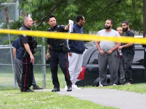 Ottawa Police investigate a shooting on Banff Ave. In Ottawa Tuesday afternoon.