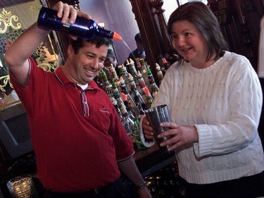 Ottawa Sun page sixer Sue Sherring gets a few tips from Jeff O'Reilly at D'Arcy McGee's Irish Pub while job shadowing him at the Sparks Street business.