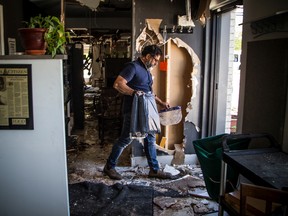 File photo: Joe Thottungal, award-winning chef and owner of Coconut Lagoon, shows damage after a fire broke out at the former venue of the popular restaurant, Saturday, May 23, 2020.