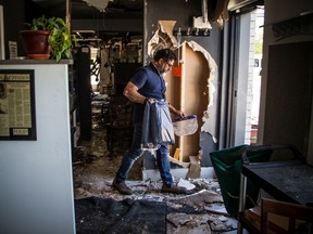 File photo: Joe Thottungal, an award-winning chef and owner of Coconut Lagoon, shows the damage after a fire broke out at the popular restaurant’s former space, Saturday, May 23, 2020.