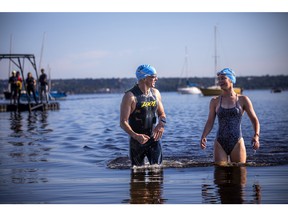 The Riverkeeper Open Water Swim race took place in the Ottawa River, starting and finishing at the Lac Deschênes Sailing Club, Sunday, August 14, 2022. Robert Landriault and Charlotte Anderson congratulate each other as the finish the last stretch of the 1.5K race Sunday morning.