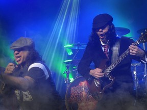 Mimmo Oli, left, and Yan ‘Johnny’ Vetaris, aka Angus Yan, of the AC/DC tribute bane 21 Gun Salute. They’ll be performing at LeBreton Flats on Aug. 28 as part of Nostalgia Music Festival.