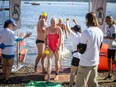 Author and former MP Catherine McKenna crosses the line of the 2022 4K  Riverkeeper Open Water Swim in less than an hour and thirteen minutes.