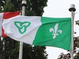 File photo: The Franco-Ontarian flag flies alongside the Canadian flag.
