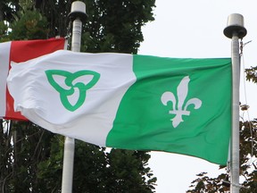 File Photo: The Franco-Ontarian flag flies alongside the Canadian flag.