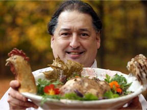 Jean-Claude Chartrand, chef and owner of L’Oree du Bois in Chelsea, in an October 2014 photo with his dish Beggar’s Chicken, which cooks five hours inside a clay wrap and won a Quebec-wide contest.