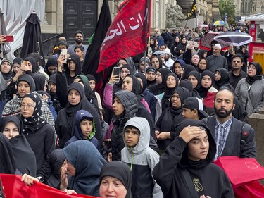 Shias march through downtown Ottawa during a commemoration of the martyrdom of Imam Hussain, grandson of the Islamic prophet Mohammad, on Monday, Aug. 8, 2022.