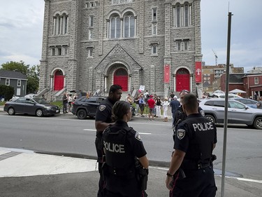 Ottawa Police across the street from the former St. Brigid's church in Lowertown where members of The United People of Canada (TUPOC) have taken up residence.