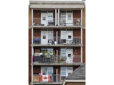 A small sign saying LEAVE on an apartment balcony across from the former St. Brigid's church in Lowertown where The United People of Canada (TUPOC) have taken up residence.