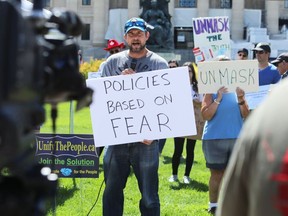 Patrick Allard of Manitoba Together speaks during a March to Unmask event in front of the Manitoba Legislative Building on Sun., July 19, 2020.