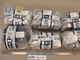 Photos regarding the seizure in Melbourne, Australia, of that country's largest stash of fentanyl, which was found inside military surplus ammunition boxes hidden in an industrial lathe that had been shipped from Canada.