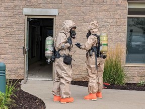 Ottawa firefighters don hazmat suits to to investigate fumes at an east end hotel April 27, 2022.