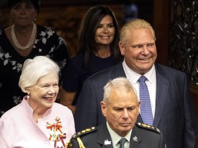 Ontario Lt.-Gov. Elizabeth Dowdeswell, left, and Ontario Premier Doug Ford enter the legislative chamber before the throne speech at Queen's Park in Toronto on Aug. 9, 2022.