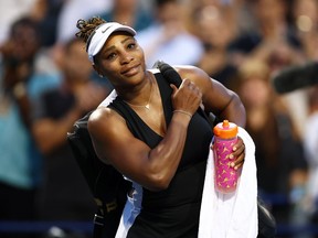Serena Williams smiles as she leave the court after losing to Belinda Bencic of Switzerland during the National Bank Open in Toronto, August 10, 2022.
