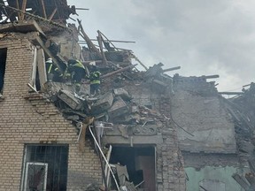 Files: Rescuers work at a site of a school building destroyed by a Russian military strike, as Russia's attack on Ukraine continues, in the town of Mykolaivka, in Donetsk region, Ukraine.