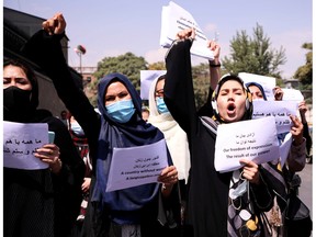 Afghan women's rights defenders and civil activists call on the Taliban to respect their achievements and education, in front of the presidential palace in Kabul last September. Despite their efforts, women's rights are being eroded.