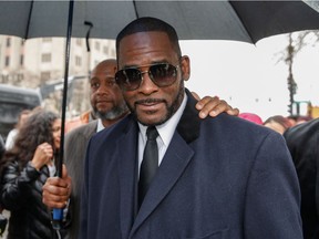 (FILES) In this file photo taken on May 7, 2019, R. Kelly leaves the Leighton Criminal Court Building after a hearing on sexual abuse charges in Chicago, Illinois.