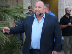Alex Jones steps outside of the Travis County Courthouse, to do interviews with media after he was questioned under oath about text messages and emails by lawyer Mark Bankston, in Austin, Texas, U.S. August 3, 2022.