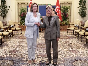 U.S. House of Representatives Speaker Nancy Pelosi shakes hands with Singapore's President Halimah Yacob in Singapore August 1, 2022.