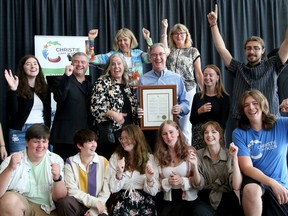 In recognition of Christie Lake Kids milestone of 100 years, Ottawa mayor Jim Watson (centre, surrounded by former campers, current counsellors and supporters) proclaimed August 16th Christie Lake Kids Day Tuesday at city hall.