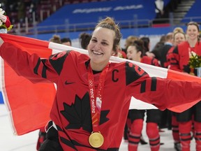 Team Canada forward Marie-Philip Poulin celebrates with her gold medal after defeating the United States in women's hockey gold medal game action at the 2022 Winter Olympics in Beijing on Thursday, Feb. 17, 2022. Poulin is the only hockey player in the world, male or female, to score goals in four straight Olympic hockey finals.THE CANADIAN PRESS/Ryan Remiorz