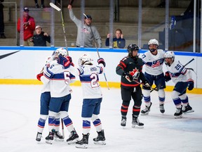 The players of USA celebrate after Megan Keller has reduced to 2-1 during The IIHF World Championship Woman's ice hockey match between Canada and USA in Herning, Denmark, Tuesday, Aug 30, 2022.