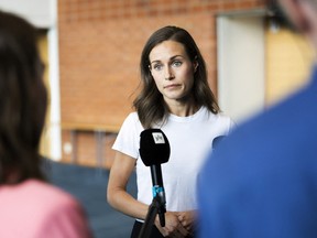 Finland's prime minister, Sanna Marin, speaks with members of the media in Kuopio, Finland August 18, 2022.