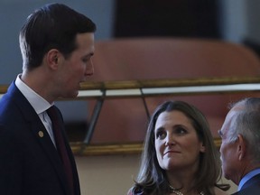 Deputy Prime Minister of Canada Chrystia Freeland, center, and the chief of staff of Mexican President Andres Manuel Lopez Obrador Fernado Romo, listen to White House senior adviser Jared Kushner during an event to sign an update to the North American Free Trade Agreement, at the national palace in Mexico City, Tuesday, Dec. 10. 2019.