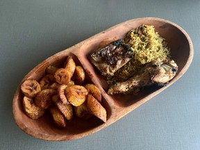 Quarter chicken with rice and plantain at Safari Grill in Lowertown. Photo by Peter Hum
