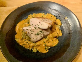 Slow-cooked chicken breast with pearl couscous, vegetables and crispy chicken skin, roasted bell pepper cream sauce at L’Orée du Bois, photo by Peter Hum