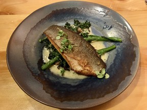 Pan-seared sea bass, broccolini, pan-seared mushrooms, blue cheese sauce at L’Orée du Bois