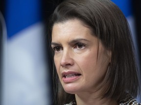 Quebec Public Security Minister Geneviève Guilbault responds to reporters' questions about legislation on public security, Wednesday, Dec. 8, 2021, at the legislature in Quebec City.