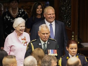 Ontario Lt.-Gov. Elizabeth Dowdeswell, left, and Ontario Premier Doug Ford enter the Legislative Chamber before the Throne Speech at Queens Park Aug. 9.