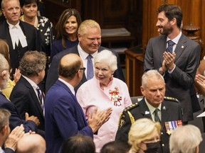 Ontario Lieutenant Governor Elizabeth Dowdeswell, front, and Ontario Premier Doug Ford enter the Legislative Chamber before the Throne Address in Queens Park in Toronto on Tuesday.