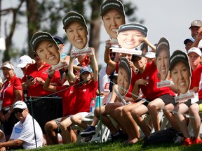 Brooke Henderson fans during the first round at the CP Women's Open at the Ottawa Hunt & Golf Club Thursday.